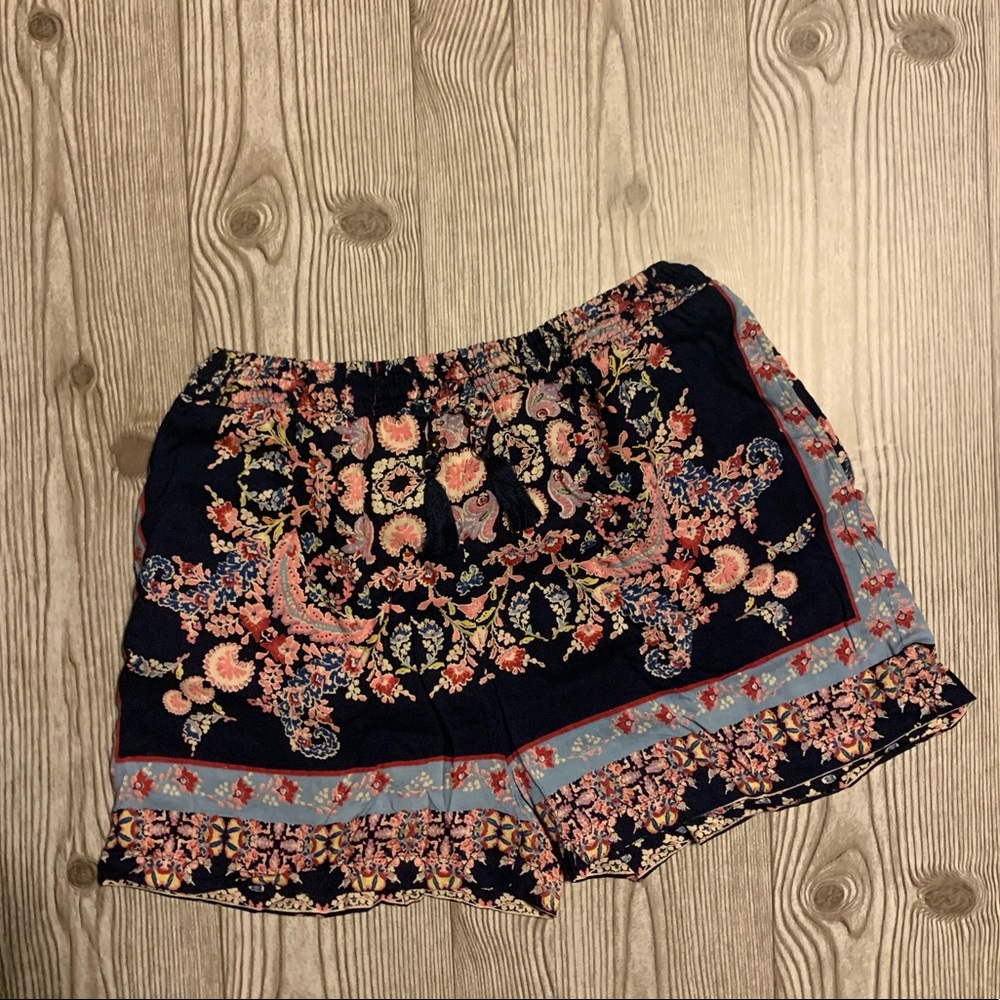 Size small summer shorts. Stretchy with a tie at the waist and pockets.